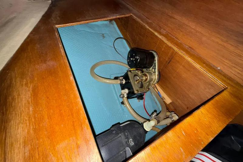Slide: The Image of Bilge pump system in 1986 Sabre 30 MKIII sailboat, wooden compartment. - 50
