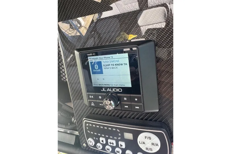 Slide: The Image of JL Audio system on 2025 Nor-Tech 390 Sport Center Console, displaying music track. - 13