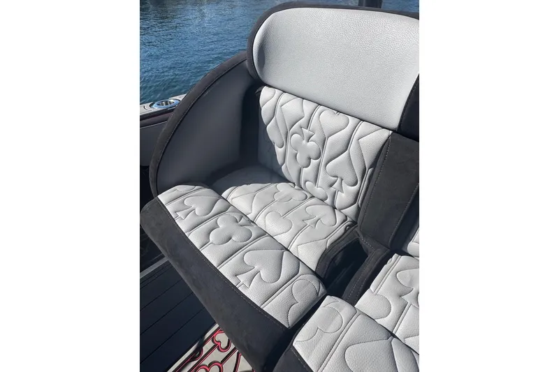 Slide: The Image of 2025 Nor-Tech 390 Sport Center Console seat with card suit pattern upholstery. - 14
