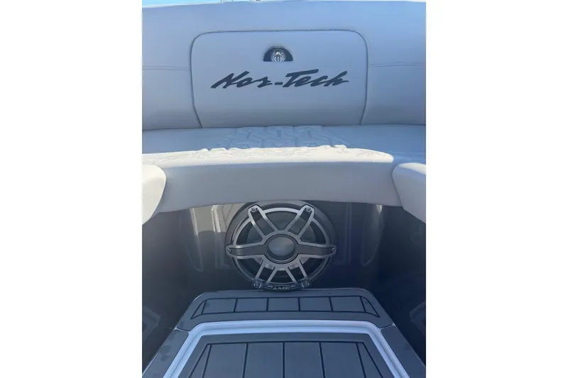 Slide: The Image of 2025 Nor-Tech 390 Sport Center Console interior with speaker and logo detail. - 16
