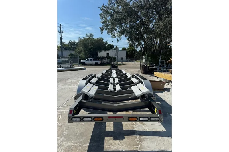 Slide: The Image of Trailer for 2025 Nor-Tech 390 Sport Center Console, parked outdoors. - 18