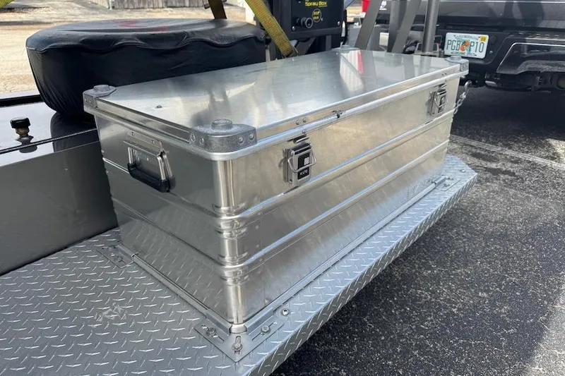 Slide: The Image of Aluminum storage box on Nor-Tech 390 Sport Center Console, 2025 model, with diamond plate flooring. - 23