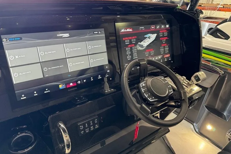 Slide: The Image of 2025 Nor-Tech 390 Sport Center Console dashboard with advanced navigation and control systems. - 7