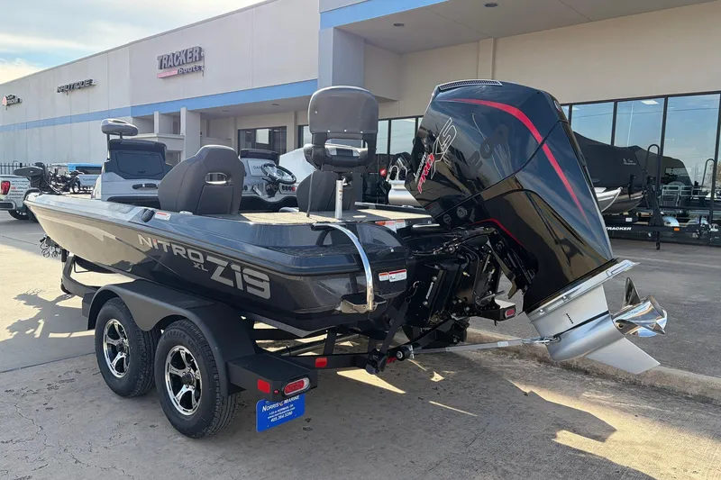 Slide: The Image of 2026 Nitro Z19 XL Pro boat with powerful outboard motor, parked outside dealership. - 10