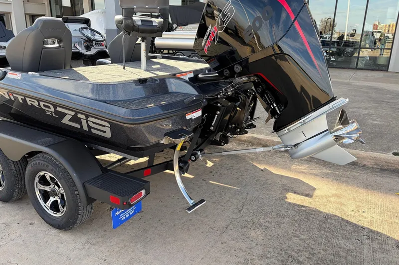 Slide: The Image of 2026 Nitro Z19 XL Pro boat with powerful outboard motor, parked on a trailer. - 11