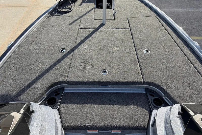 Slide: The Image of 2026 Nitro Z19 XL Pro boat deck with carpeted surface and storage compartments. - 19