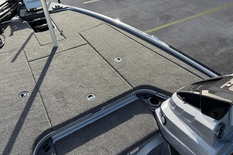 Slide: The Image of 2026 Nitro Z19 XL Pro boat deck with carpeted surface and storage compartments. - 20
