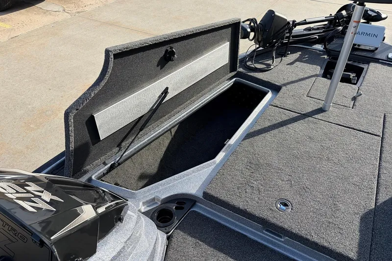Slide: The Image of 2026 Nitro Z19 XL Pro boat with open storage compartment and Garmin equipment. - 21