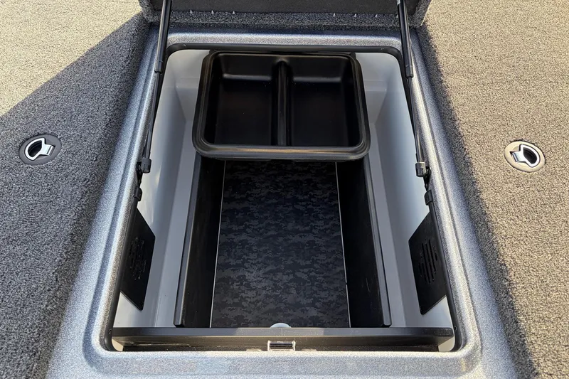 Slide: The Image of 2026 Nitro Z19 XL Pro boat storage compartment with open lid and organizer tray. - 24