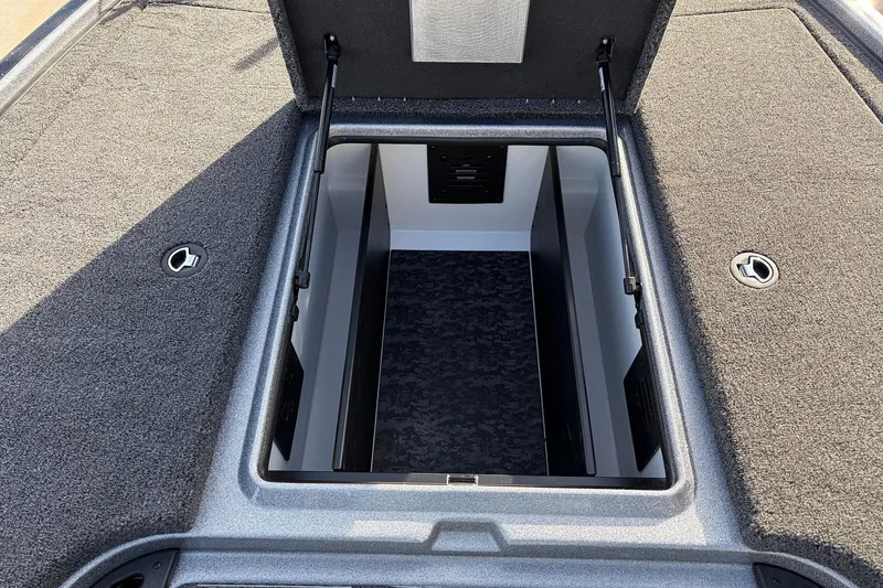 Slide: The Image of Open storage compartment of 2026 Nitro Z19 XL Pro boat. - 25
