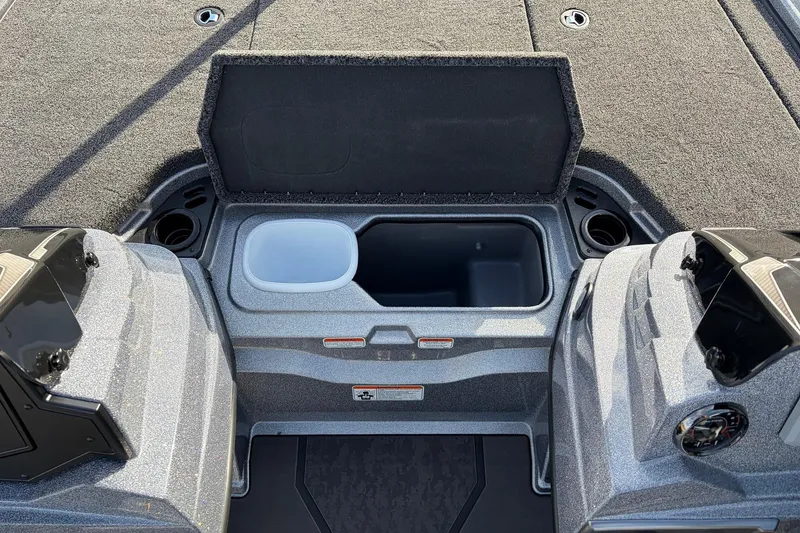Slide: The Image of 2026 Nitro Z19 XL Pro boat storage compartment with open lid and cup holders. - 31