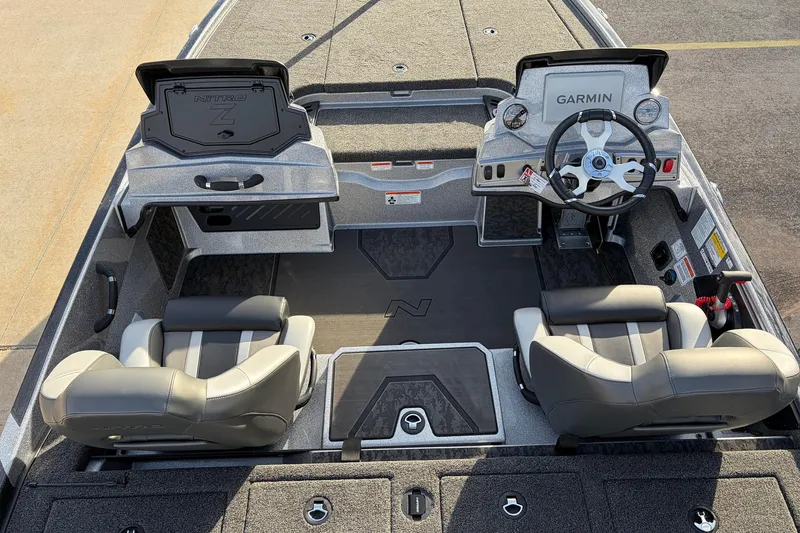 Slide: The Image of 2026 Nitro Z19 XL Pro boat interior with dual seats and Garmin dashboard. - 33