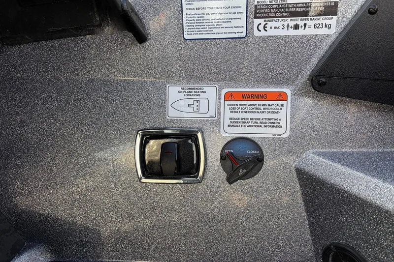 Slide: The Image of Control panel of 2026 Nitro Z19 XL Pro boat with warning labels and switches. - 40