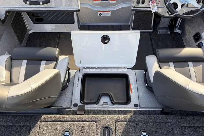 Slide: The Image of 2026 Nitro Z19 XL Pro boat interior with open storage compartment and two seats. - 42