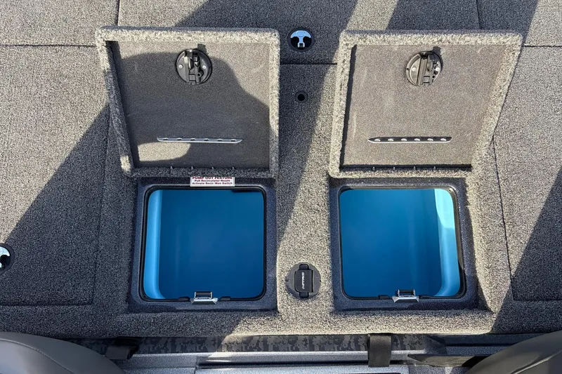 Slide: The Image of 2026 Nitro Z19 XL Pro boat storage compartments with open lids, showcasing interior design. - 49