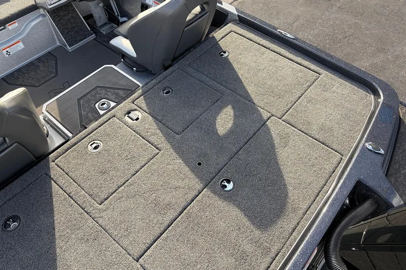 Slide: The Image of 2026 Nitro Z19 XL Pro boat interior with carpeted storage compartments and seating. - 54