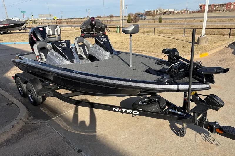 Slide: The Image of 2026 Nitro Z19 XL Pro fishing boat on trailer, parked outdoors. - 6