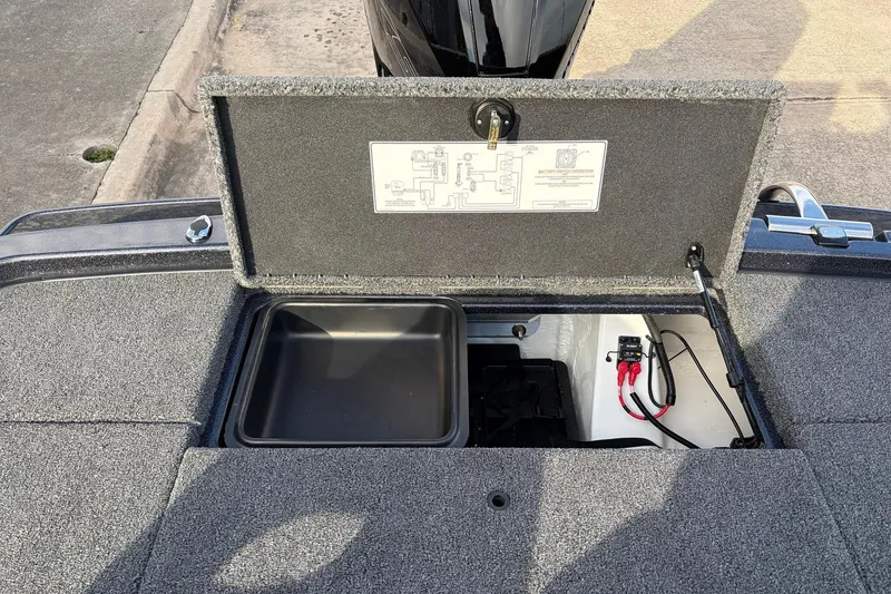 Slide: The Image of 2026 Nitro Z19 XL Pro boat storage compartment with open lid and wiring visible. - 60