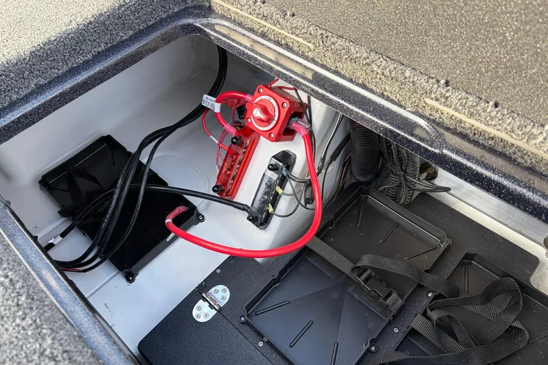 Slide: The Image of 2026 Nitro Z19 XL Pro boat battery compartment with wiring and components. - 62