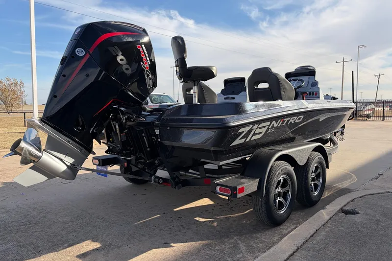 Slide: The Image of 2026 Nitro Z19 XL Pro boat with powerful outboard motor on a trailer. - 8