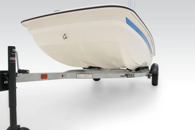 Slide: The Image of 2026 Mako Pro Skiff 15 CC boat parked in a sunny lot. - 8