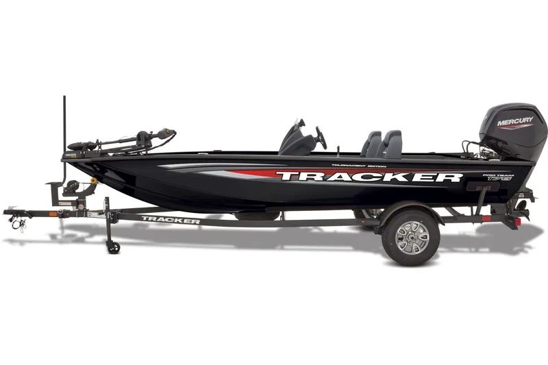 Slide: The Image of 2026 Tracker Pro Team 175 boat interior with gray carpet and storage compartments. - 7