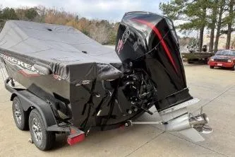 Slide: The Image of 2024 Tracker Targa V-19 WT boat with cover and powerful outboard motor. - 2