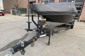 Slide: The Image of 2024 Tracker Targa V-19 WT boat on trailer, covered, parked outdoors. - 4