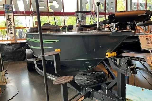 Slide: The Image of 2026 Ranger VX1888 WT boat on display in showroom with trailer. - 111