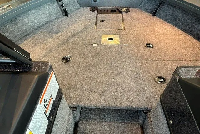 Slide: The Image of Interior view of 2026 Ranger VX1888 WT boat, featuring spacious carpeted deck. - 16