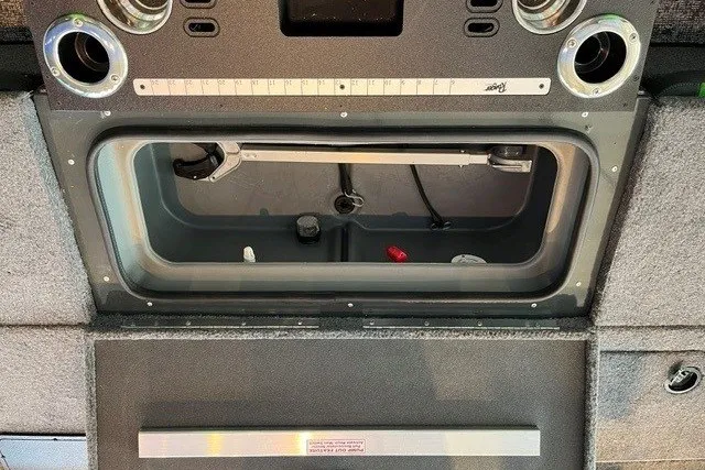 Slide: The Image of Interior view of 2026 Ranger VX1888 WT boat's storage compartment and control panel. - 17