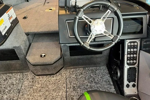 Slide: The Image of 2026 Ranger VX1888 WT boat interior with steering wheel and control panel. - 13