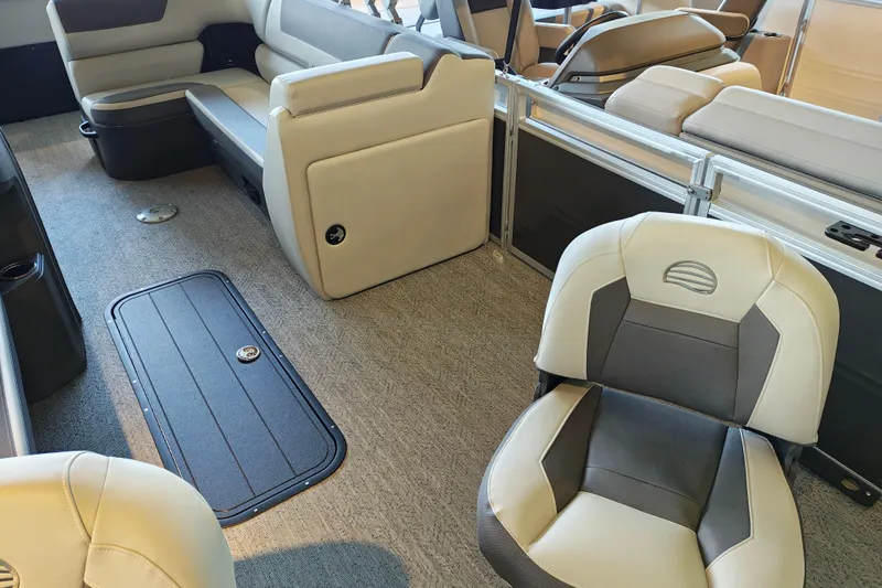 Slide: The Image of Interior of 2026 Sun Tracker Fishin' Barge 22 XP3, featuring comfortable seating and storage. - 103