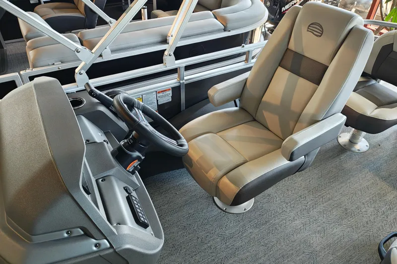 Slide: The Image of Captain's chair and helm of 2026 Sun Tracker Fishin' Barge 22 XP3 pontoon boat. - 105
