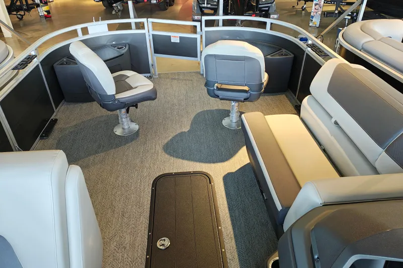 Slide: The Image of 2026 Sun Tracker Fishin' Barge 22 XP3 interior with seating and carpeted floor. - 113