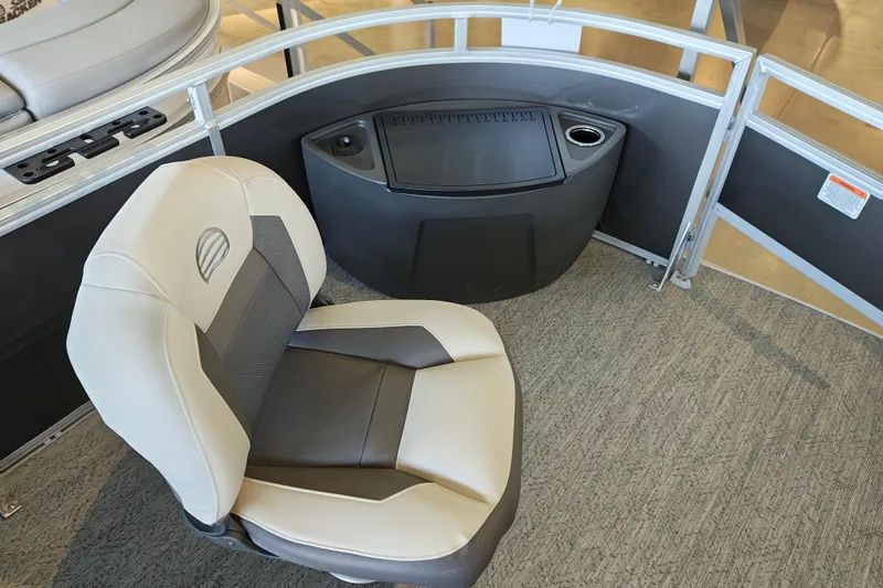 Slide: The Image of 2026 Sun Tracker Fishin' Barge 22 XP3 interior with seating and storage. - 114