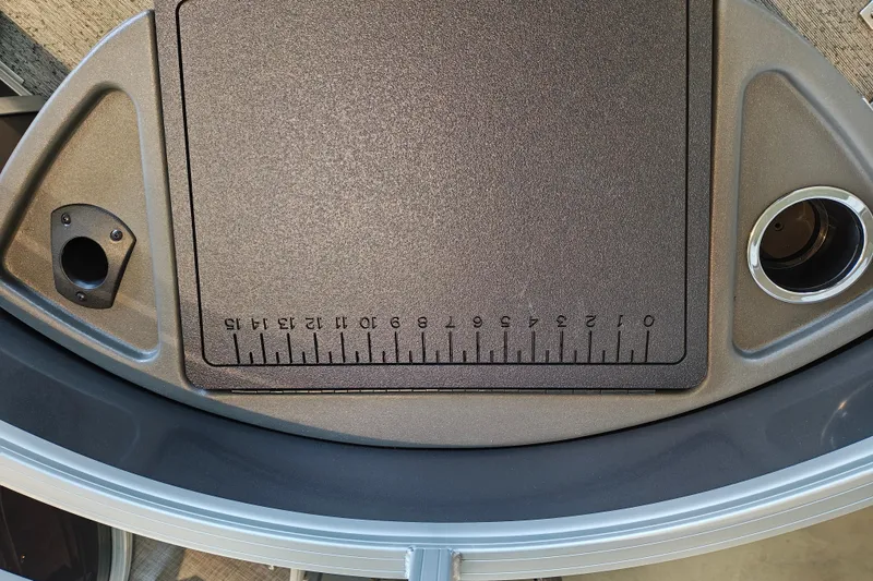 Slide: The Image of 2026 Sun Tracker Fishin' Barge 22 XP3 deck with integrated ruler and cup holder. - 116