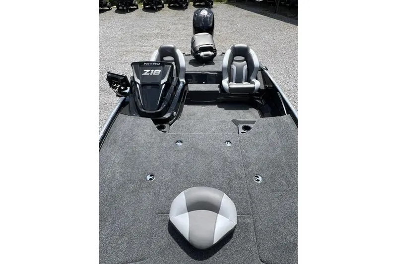Slide: The Image of 2026 Nitro Z18 boat interior with seating and carpeted deck. - 93