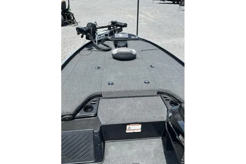 Slide: The Image of 2026 Nitro Z18 boat deck with trolling motor and carpeted surface. - 95