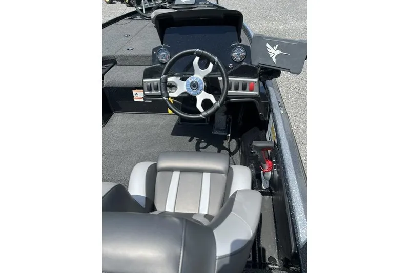 Slide: The Image of Interior view of 2026 Nitro Z18 boat cockpit with steering wheel and seat. - 96