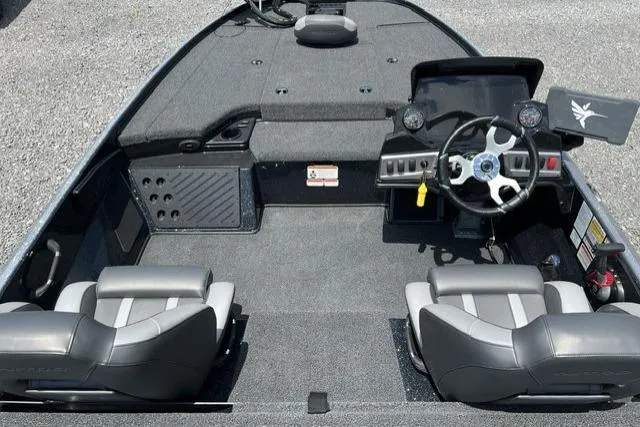 Slide: The Image of 2026 Nitro Z18 boat interior with dual seats, steering wheel, and control panel. - 97