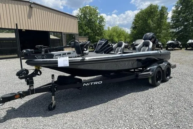 Slide: The Image of 2026 Nitro Z18 boat on trailer in outdoor dealership lot. - 99