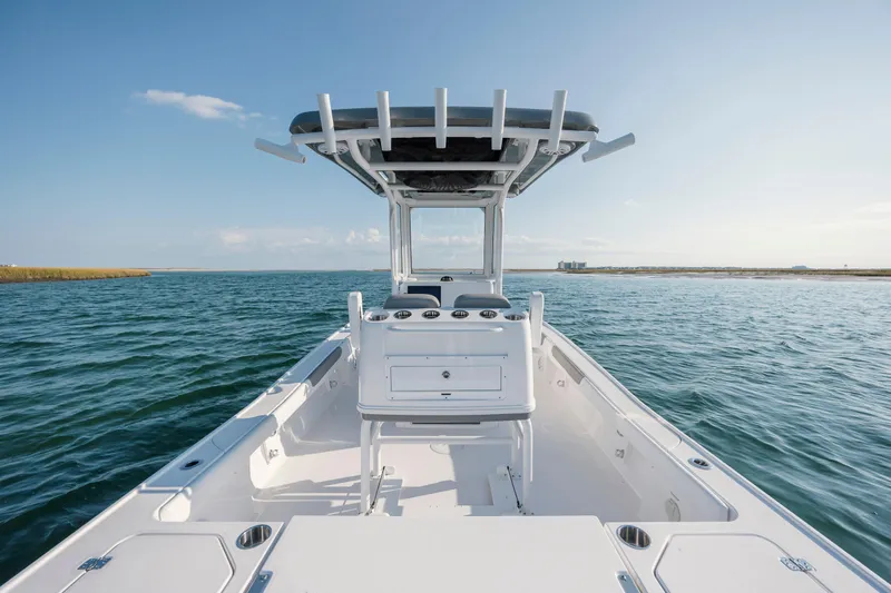 Slide: The Image of Caymas 26 HB 2026 on open water under clear sky. - 25