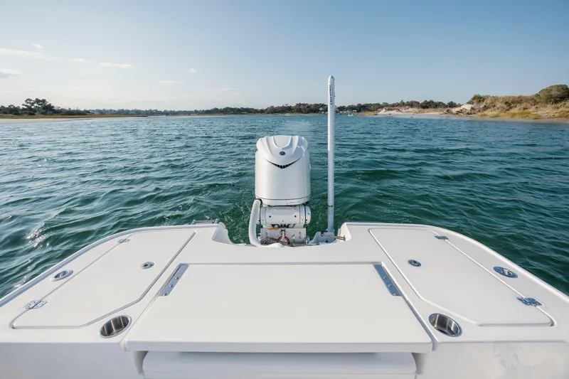 Slide: The Image of Rear view of Caymas 26 HB boat on open water. - 28