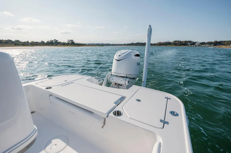 Slide: The Image of Caymas 26 HB 2026 on calm waters with coastal view. - 29