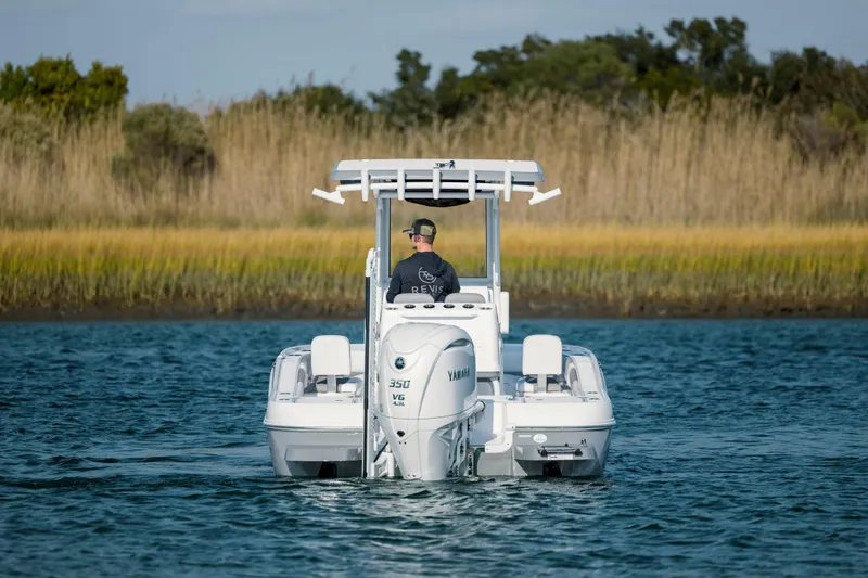 Slide: The Image of Caymas 26 HB 2026 boat on calm water. - 3