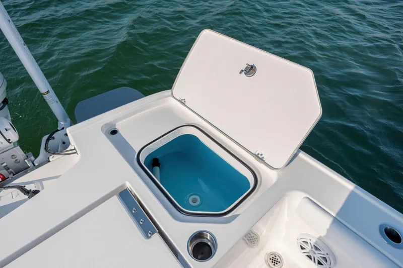 Slide: The Image of Open storage compartment on a 2026 Caymas 26 HB boat. - 31