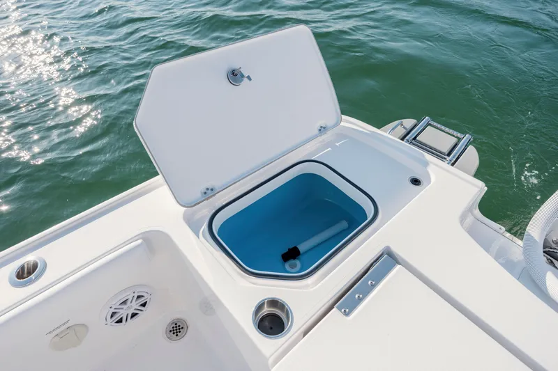 Slide: The Image of Open storage compartment on Caymas 26 HB boat, 2026 model. - 32