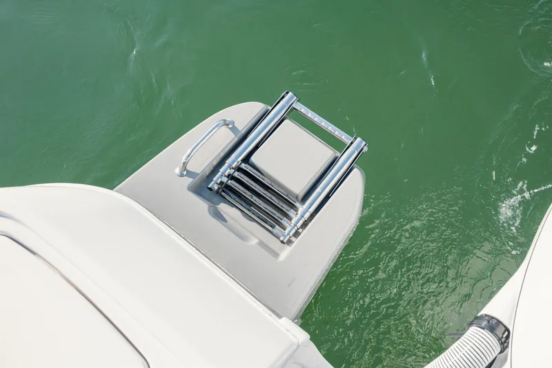 Slide: The Image of Swim ladder on Caymas 26 HB boat, 2026 model. - 33
