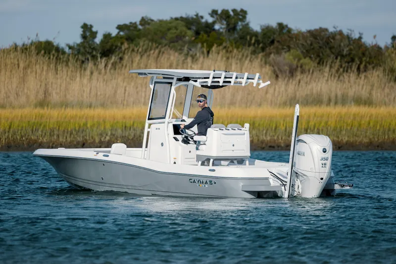 Slide: The Image of 2026 Caymas 26 HB boat on calm water. - 4